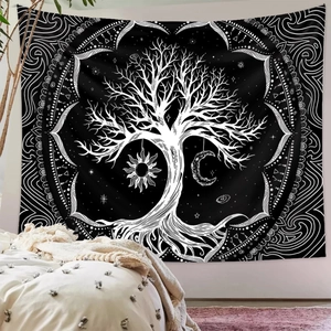Detail of bohemian tree of life tapestry with sun and moon motifs in a cozy bedroom