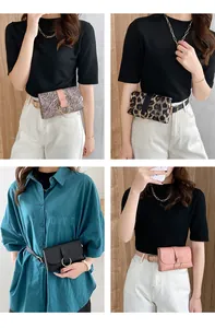 Detail showing various leopard and zebra print waist bags with large gold ring buckles