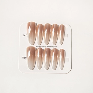 Detailed view of handmade long almond aurora gradient press-on nails on a card