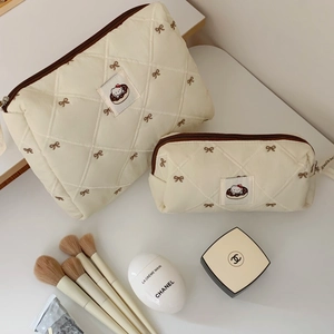 Quilted beige cosmetic bag set with brown bow embroidery and cartoon donut patch