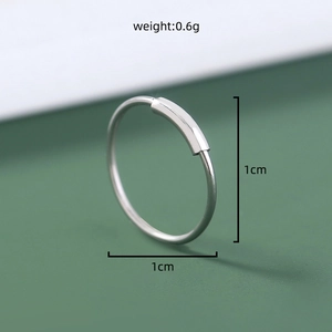 Macro view of 1cm silver stainless steel U-shaped nose ring detailing with 0.6g weight