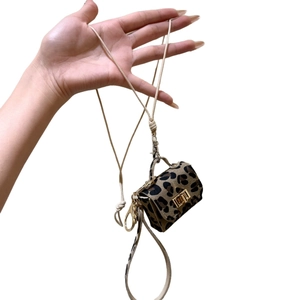 Mini leopard print handbag pendant necklace with beige braided cord and gold hardware