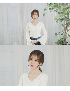 Detail view of Korean style V-neck white long sleeve knit top with flared cuffs