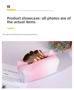 Macro detail of gradient PU leather makeup bag with V-shaped quilting and makeup brushes