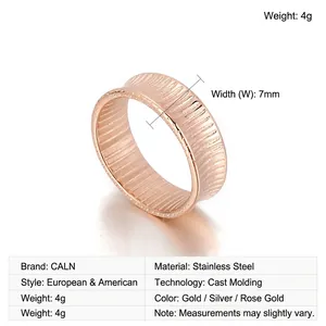 Detail of rose gold stainless steel ring featuring 7mm width and ribbed vertical texture