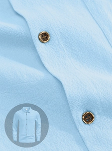 Close-up of breathable light blue linen fabric texture with a classic button-down collar