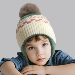Kids knitted earflap hat with jacquard tree pattern and brown faux fur pom pom