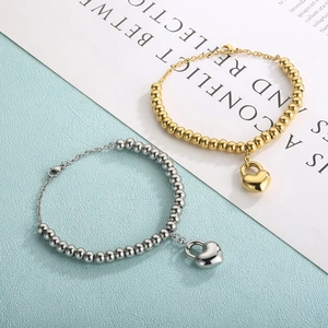 Polished stainless steel beaded heart lock bracelet in gold and silver finish
