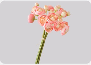 Macro detail of artificial ranunculus bridal bouquet with realistic silk petals and stem tie