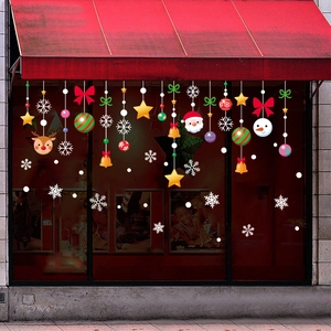 Christmas window static stickers with Santa, reindeer, and snowflakes on shop glass