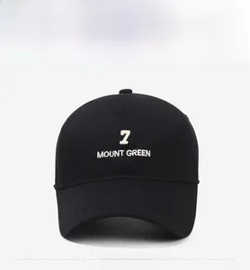 Detailed front view of black cotton baseball cap with white 7 MOUNT GREEN 3D embroidery