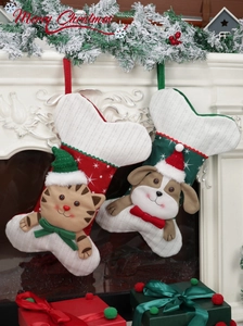 Detail of Christmas stocking set featuring 3D cartoon cat and dog on red white knit