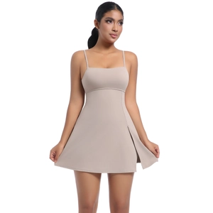 Detail view of the beige sports dress with thin straps and side slit design