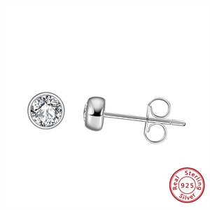 Macro detail of S925 sterling silver stud earrings with sparkling round cubic zirconia