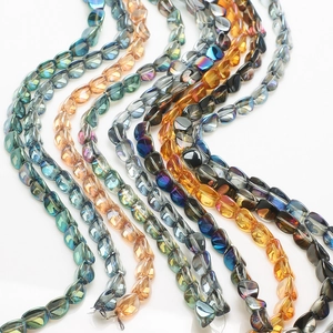Macro detail of iridescent 10x12mm twisted glass beads for DIY jewelry making and decor
