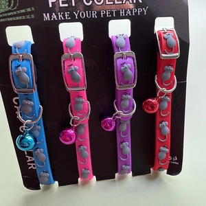 Detail showing pet collars in four colors with mouse motifs, bells and metal buckles