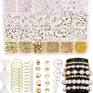 DIY jewelry making kit featuring diverse pearls, gold star beads and letter charms in a box