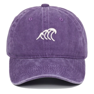 Close-up of vintage purple washed baseball cap with white wave embroidery detail