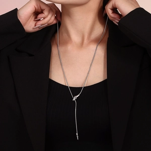 Elegant stainless steel snake head necklace on model in chic silver long chain style