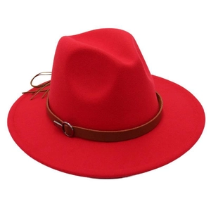 Detail of red fedora hat with brown leather belt trim and silver ring buckle accent
