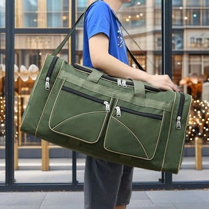 Army green large capacity men's oxford travel bag with shoulder strap worn by model