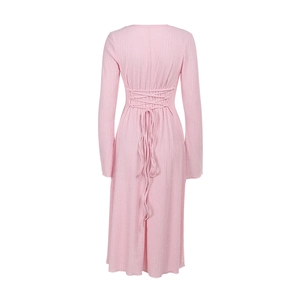 Detail of pink long-sleeved dress showing back cross-lace-up design and pleated texture