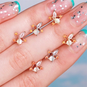 0.8mm stainless steel bee ear bone studs with orange and clear zircon stones