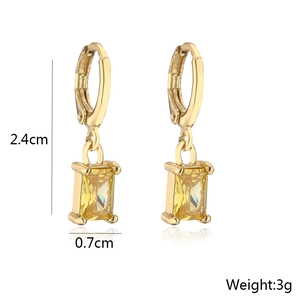 Detail view of 18K gold plated earrings with dimensions 2.4cm and yellow zircon stone