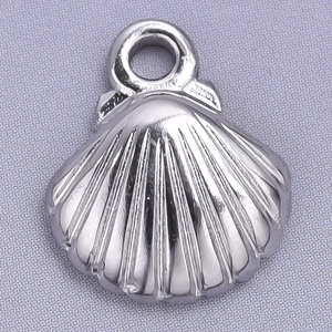 Macro shot of silver shell pendant in 304 stainless steel with detailed sea motif