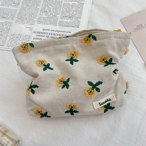 Trousse à maquillage en toile avec broderie de marguerites pour cosmétiques