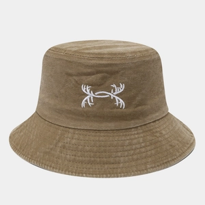 Detail of embroidered deer antler logo on washed khaki cotton bucket hat