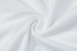 Macro detail of breathable white honeycomb lace fabric texture with soft drape effect