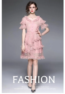 Detail of pink lace dress with V-neckline and layered ruffle sleeves for women