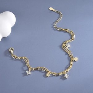 Elegant gold double-layer clover bracelet with sparkling zircon stones and adjustable chain