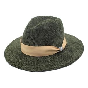 Detailed macro view of dark green chenille fedora with ribbon and rhinestone buckle