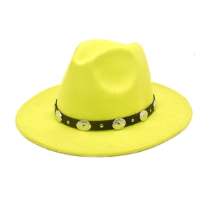 Close-up of bright yellow wool fedora featuring a black leather band with silver metal studs