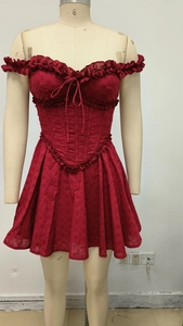 Detailed view of red off-shoulder mini dress with embroidery lace and ruffle bow