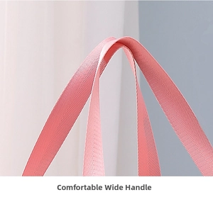 Close-up of pink widened nylon handle with reinforced twill weave on storage bag