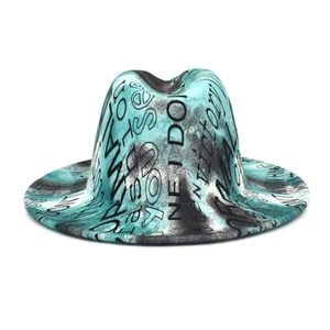 Detail view of double-sided tie-dye fedora hat with graffiti style text patterns