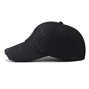 Distressed black cotton baseball cap with vintage frayed holes and classic 6-panel design