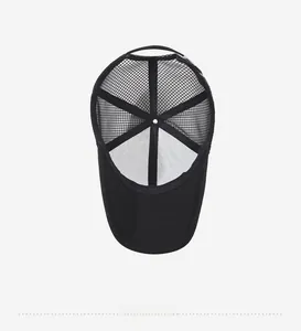 Top view showing breathable mesh interior and reinforced seams of the black trucker hat