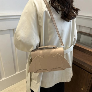 Chic beige bat-shaped shoulder bag in smooth PU leather for Halloween fashion look