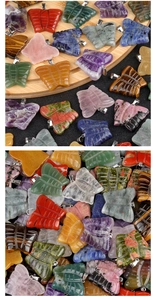 Detailed view of hand-carved natural crystal butterfly pendants with silver metal clasps