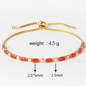 Adjustable gold bracelet detail with red rectangular and clear round zircon stones