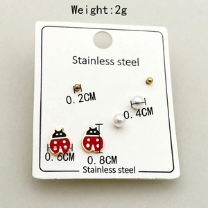 Three-piece stainless steel earring set with gold beads, pearls and ladybug charms