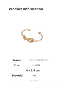 Detailed view of gold plated zircon bow bangle with 6x5.5CM dimensions and 9.6g weight