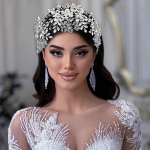 Detail of bridal headband and earring set with crystals and beads on silver base