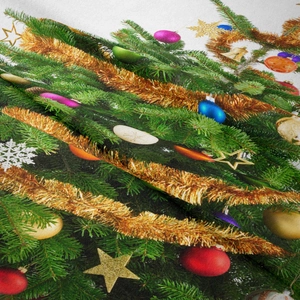 Detailed texture of fabric with Christmas tree print showing ornaments and soft folds