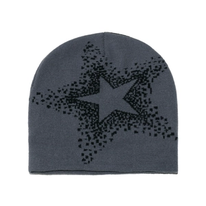 Detail of grey knitted beanie featuring a black pixelated star pattern on soft fabric