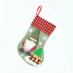 Large linen Christmas stocking with faceless gnome doll and decorative Merry Christmas text
